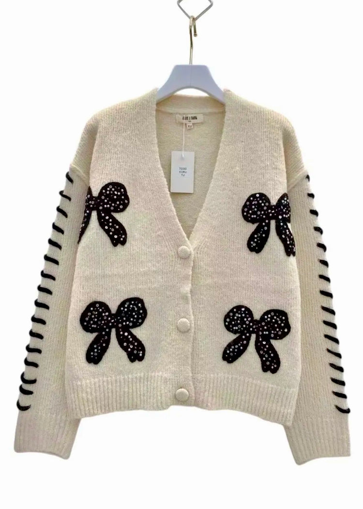 ALICIA | beige cardigan with black bow detail