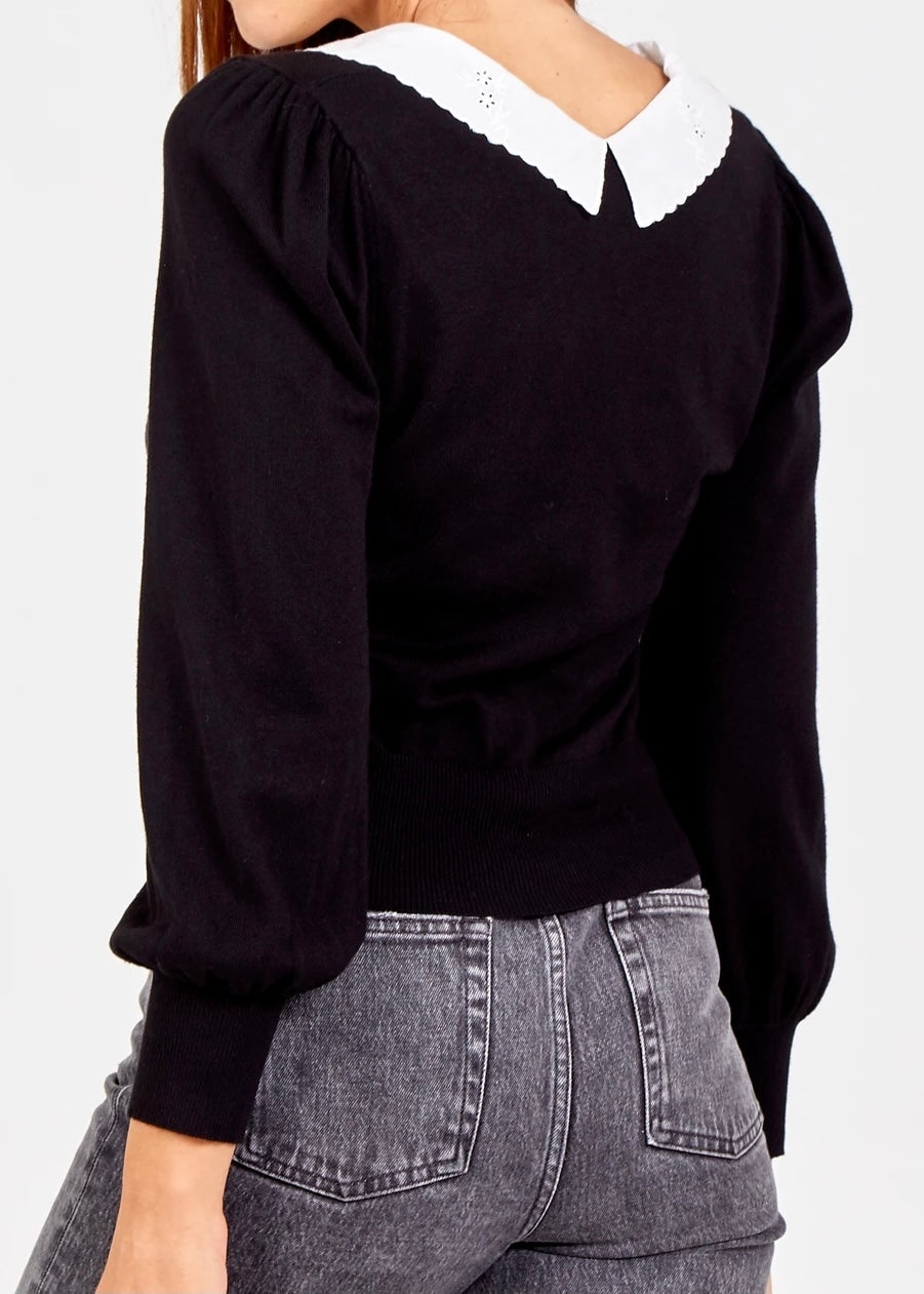 Black jumper with clearance white collar and cuffs